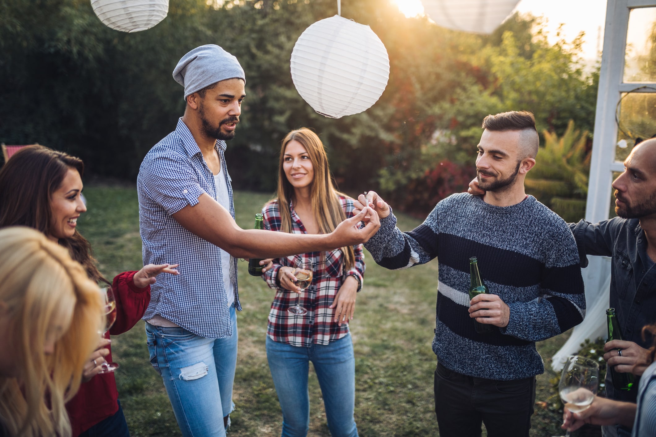 Friends sharing a smoke at a party